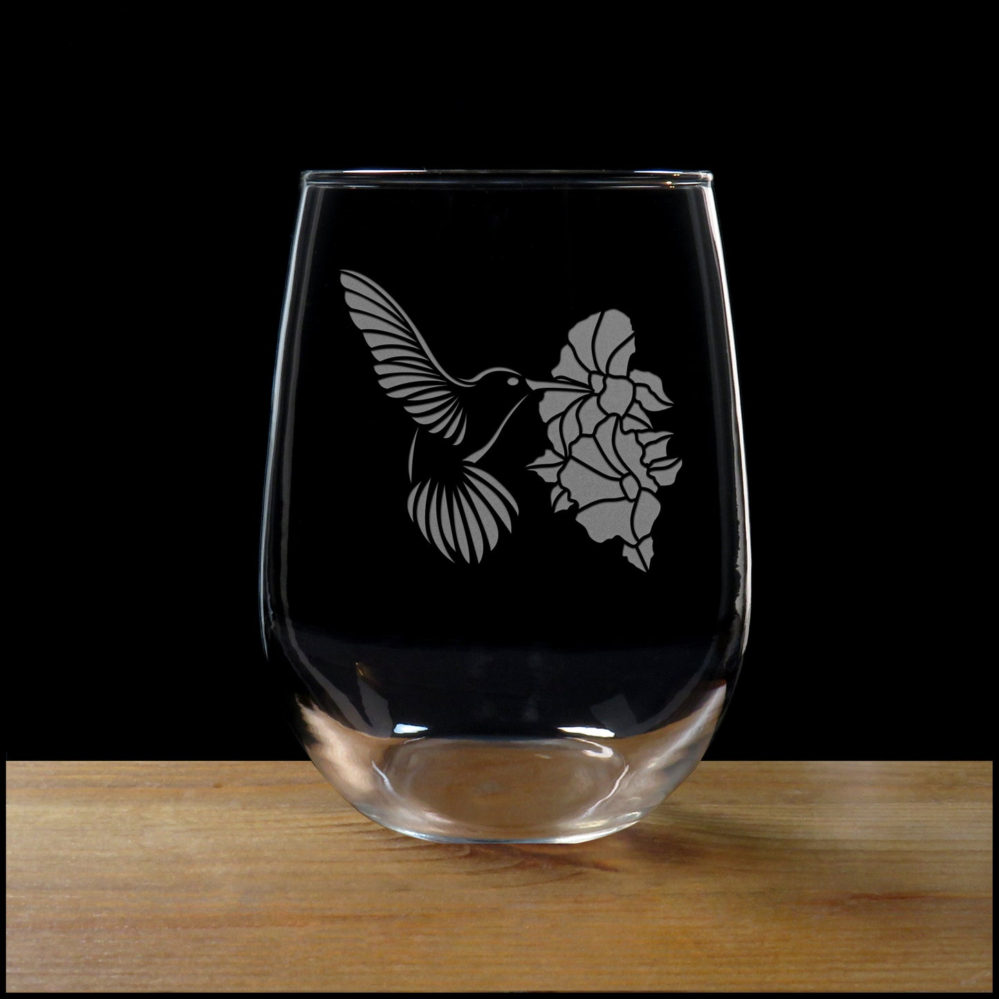 Hummingbird sipping form a Hibiscus Stemless Wine Glass - Copyright Hues in Glass