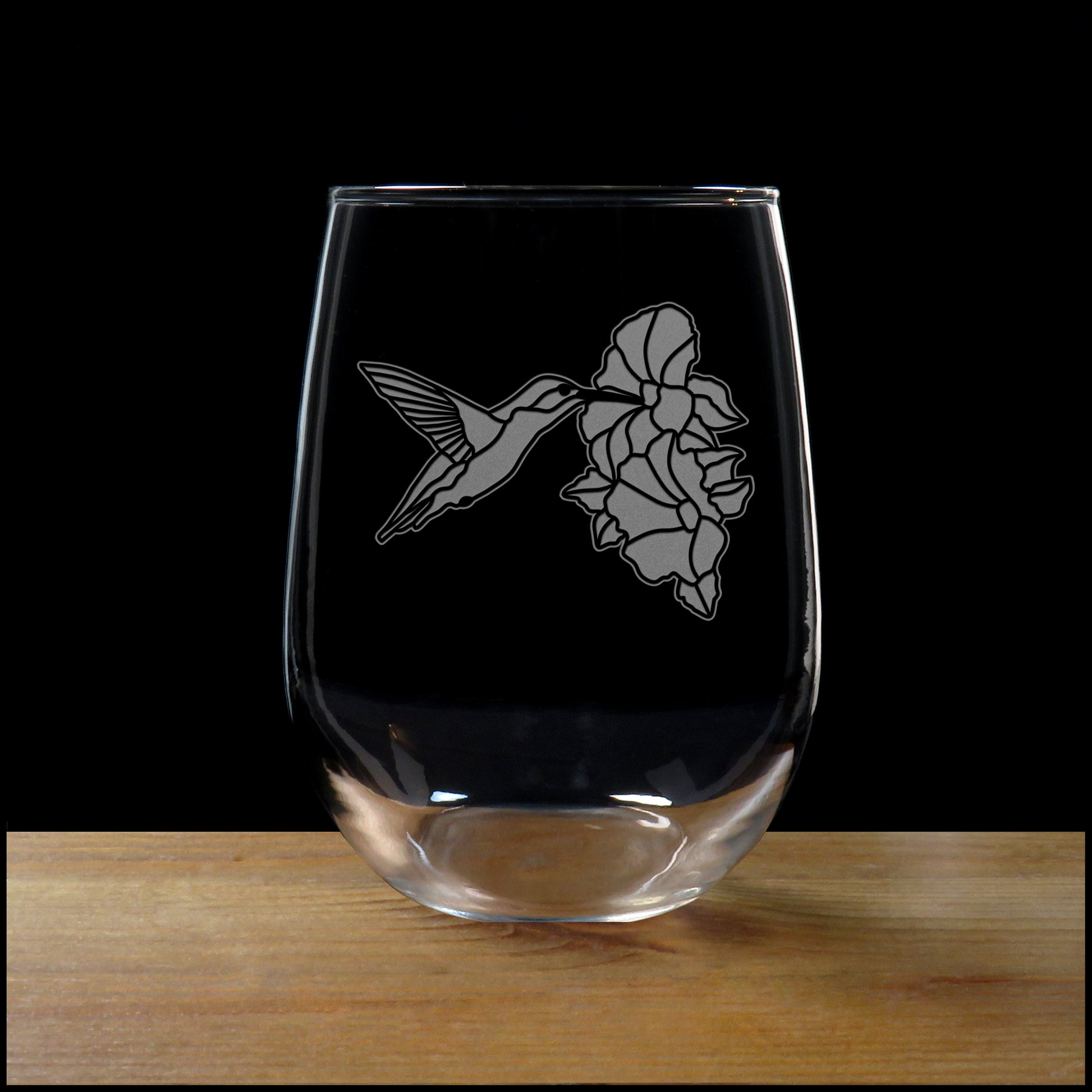 Hummingbird sipping form a Hibiscus Stemless Wine Glass - Copyright Hues in Glass