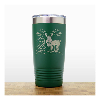 Green - Insulated Travel Mug with the design of a Reindeer sta nding beside a Christmas tree - Copyright Hues in Glass