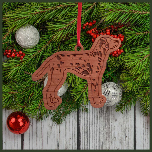 A Dalmation  cherry wood veneer ornament, with the dog in profile. 