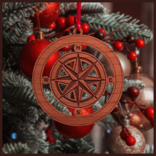 Cherry veneered ornament with a nautical compass rose cut out.