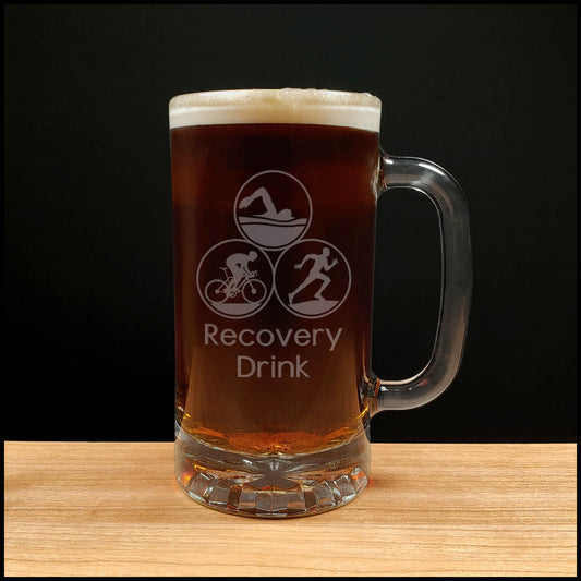 Triathlon 16oz Beer Mug with dark beer - the words Recovery Drink in sentence case under image- Copyright Hues in Glass